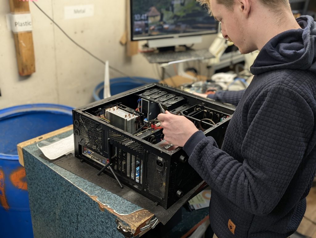 student tearing down desktop